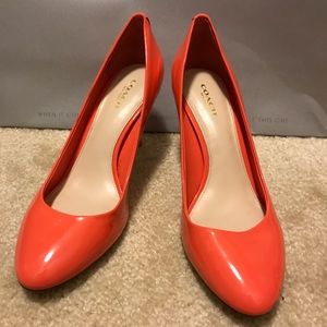 Coach patent leather pumps.